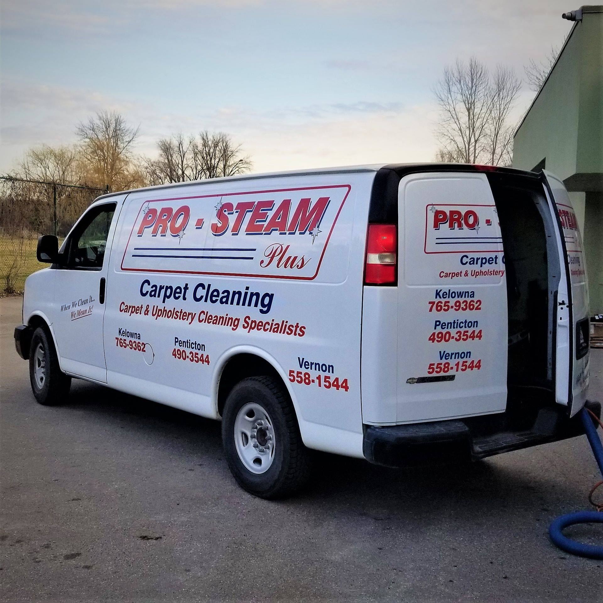 Branded Pro-Steam Plus carpet cleaning van parked outside the Okanagan service centre