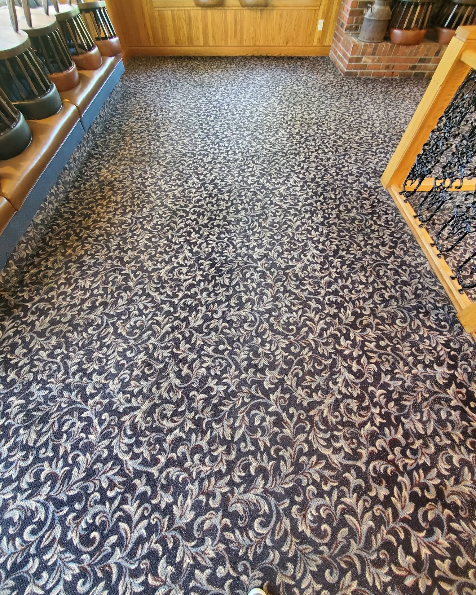 After — Before and after commercial carpet cleaning on a patterned Okanagan restaurant floor